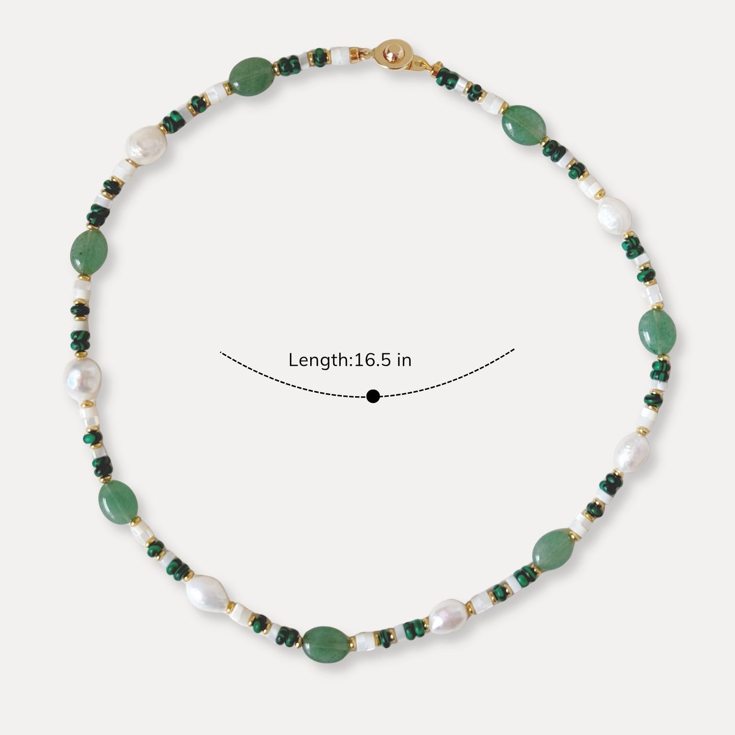 Green stone and pearl necklace shown with a 16.5 inch length for size reference.