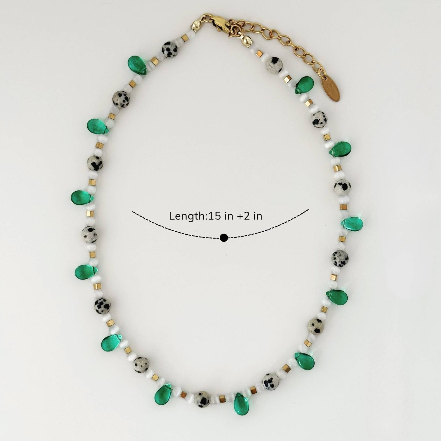 Green beaded necklace shown with 15 inch length and 2 inch extender.