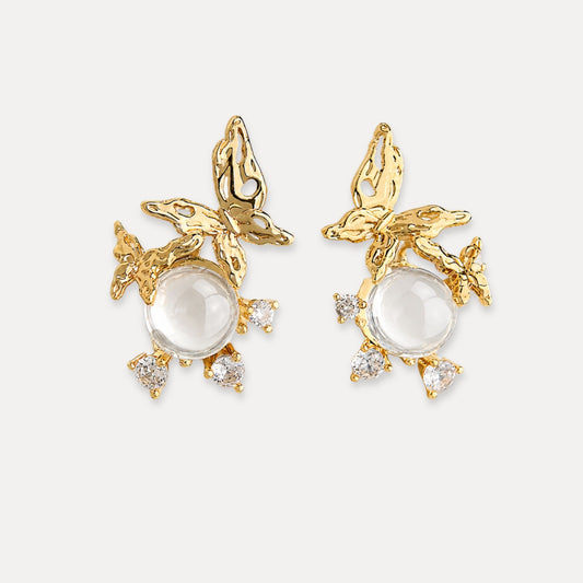 Gold butterfly earrings with glass center details and small zircon accents.