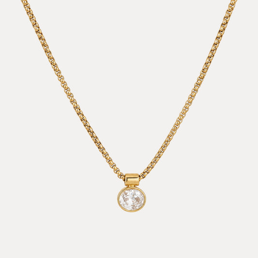 Front view of the Clear Point Oval Pendant Necklace with a clear cubic zirconia pendant and gold-toned chain