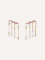 Pair of Contour freshwater pearl ear climber earrings with pink pearls and multiple dangling pearl strands.