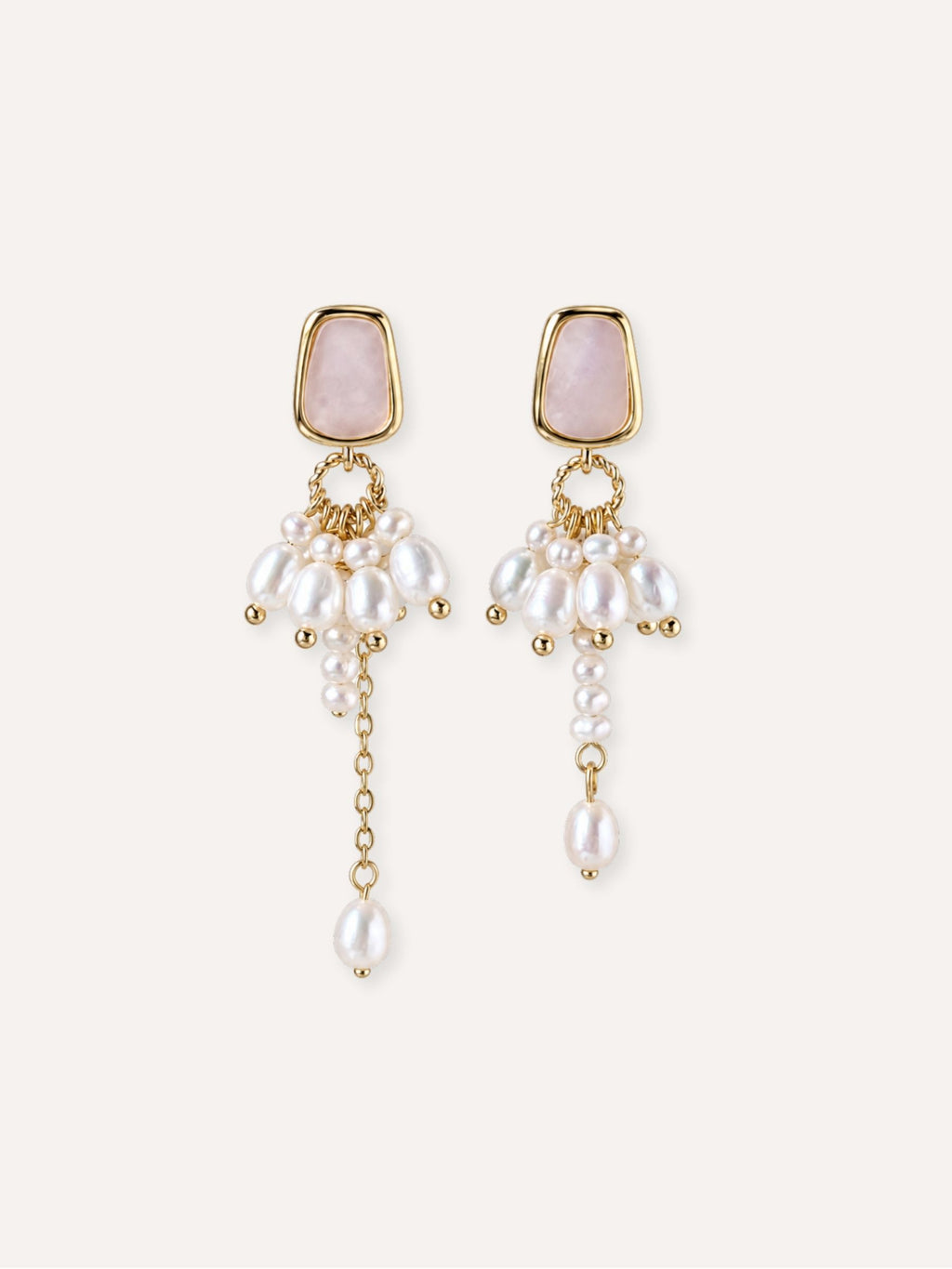 Pair of Drape freshwater pearl earrings with natural mother-of-pearl studs, clustered pearl details and asymmetric drops.