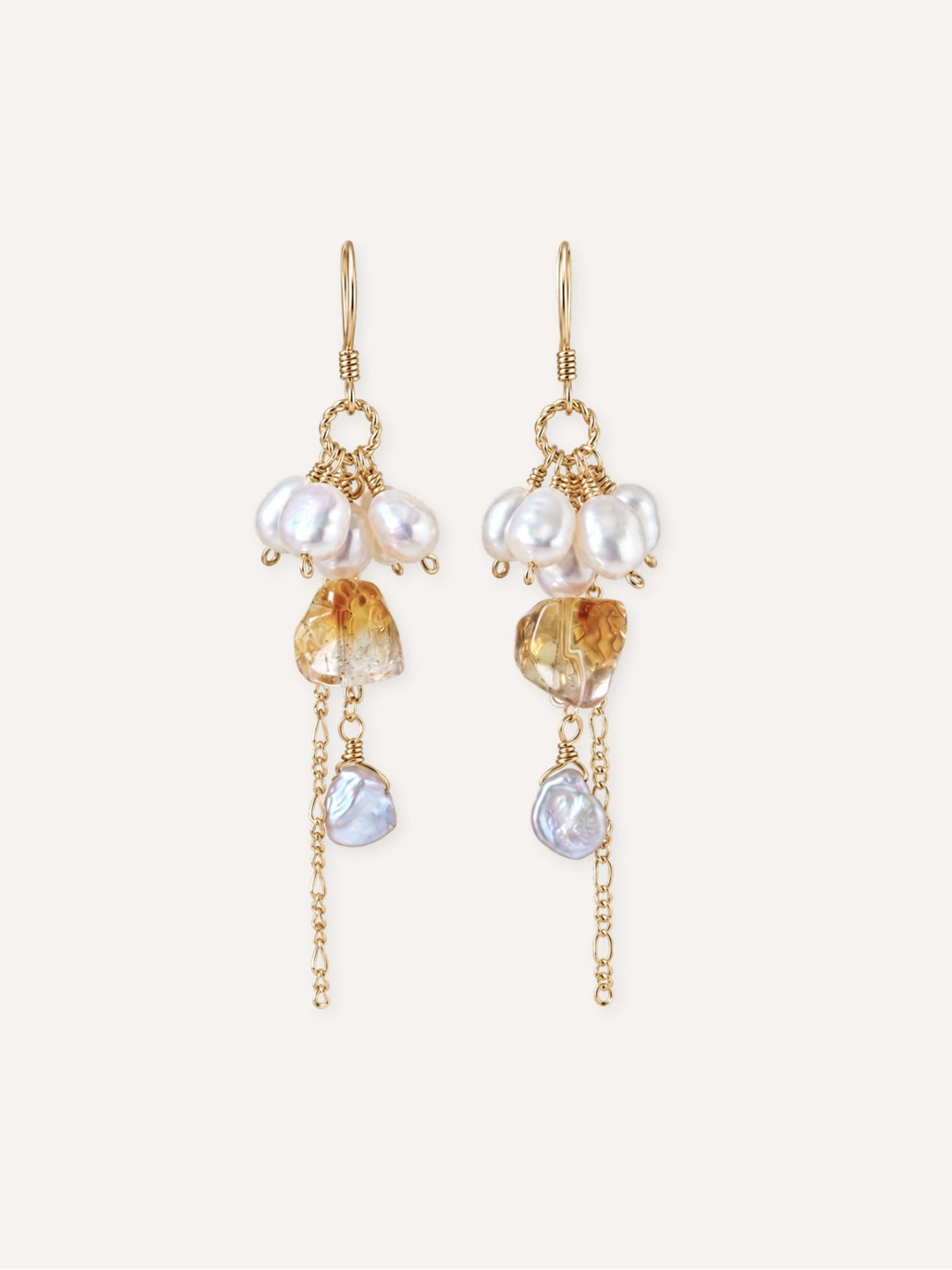 Pair of Gleam natural citrine and freshwater baroque pearl earrings with delicate gold chain drops.