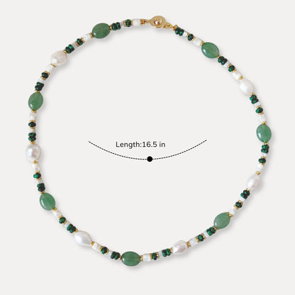 Green stone and pearl necklace shown with a 16.5 inch length for size reference.