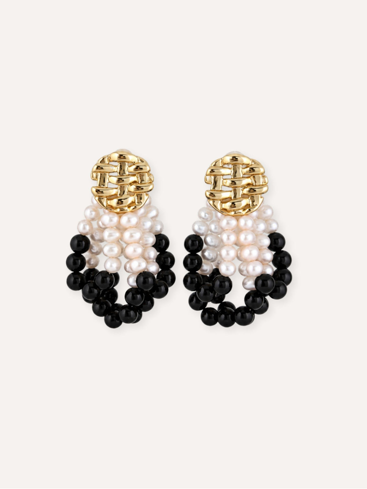 Pair of Loom freshwater pearl and black agate earrings with woven gold-plated studs.