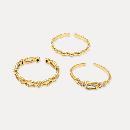 Three gold adjustable open rings with bead texture and cubic zirconia details