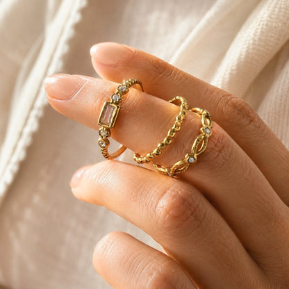 Gold open ring set with CZ accents worn stacked on fingers