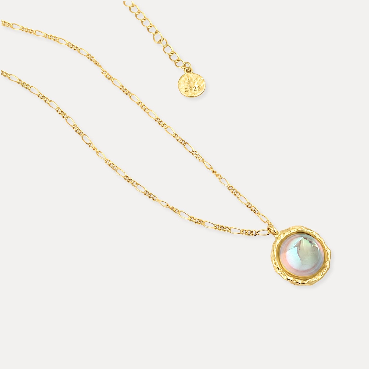 Close-up of lab-created moonstone pendant with gold-plated sterling silver setting