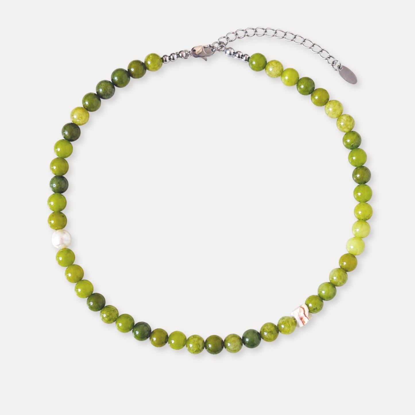 Olive green stone beaded necklace with freshwater pearl and shell accents.