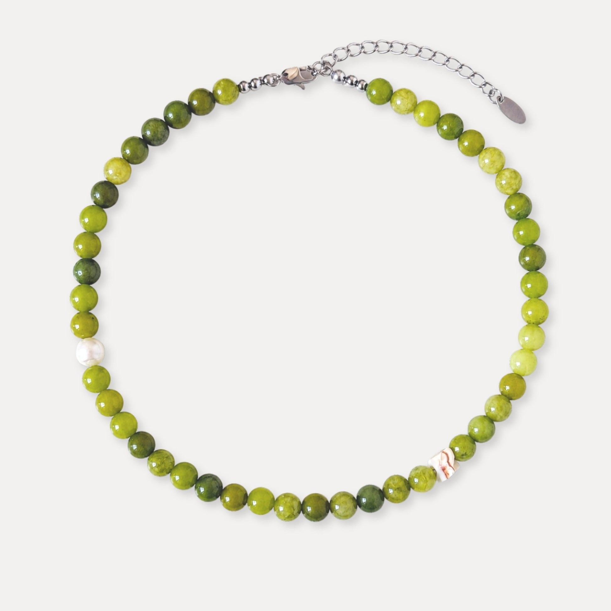 Olive green stone beaded necklace with freshwater pearl and shell accents.