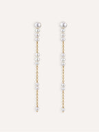 Pair of Pace long freshwater pearl earrings with delicate 14K gold-filled chains.