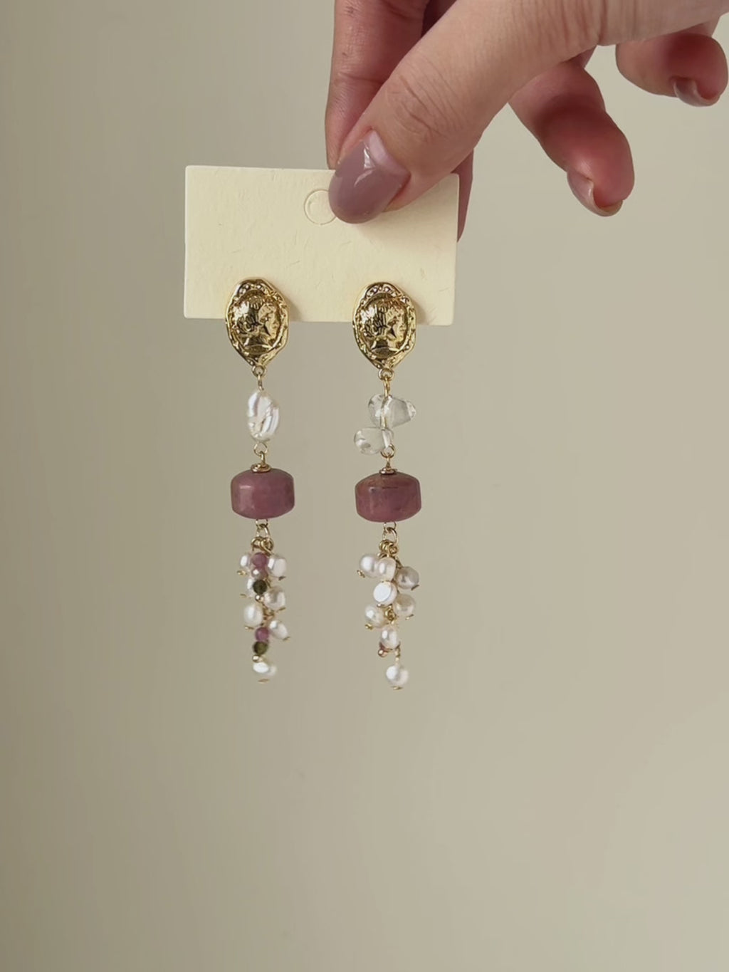 Relic rhodonite and freshwater pearl earrings shown from full product display to worn view, highlighting the gemstone details and natural movement.