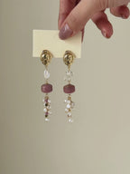 Relic rhodonite and freshwater pearl earrings shown from full product display to worn view, highlighting the gemstone details and natural movement.