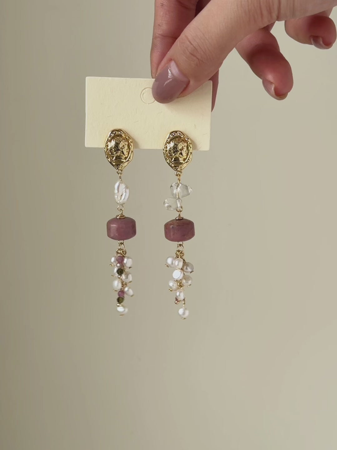 Relic rhodonite and freshwater pearl earrings shown from full product display to worn view, highlighting the gemstone details and natural movement.
