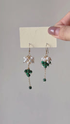 Grove natural malachite and freshwater pearl earrings shown from full product display to worn view, highlighting the clustered design and gentle movement.
