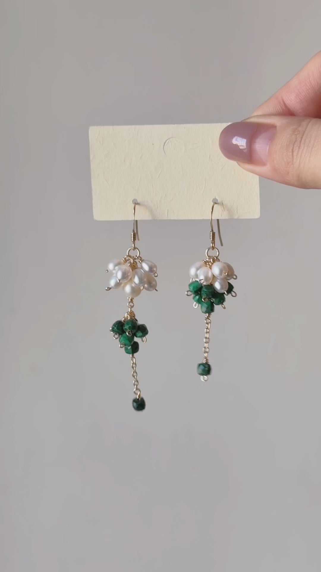 Grove natural malachite and freshwater pearl earrings shown from full product display to worn view, highlighting the clustered design and gentle movement.