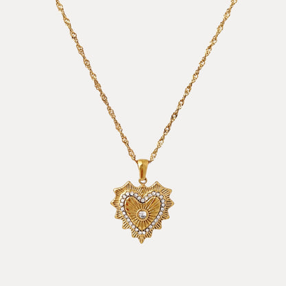 Radiant Heart Pendant Necklace with cubic zirconia details, radiating gold texture and a twisted chain