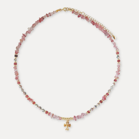 Pink strawberry quartz necklace with mixed natural stone beads, a small gold-tone charm, and adjustable chain.