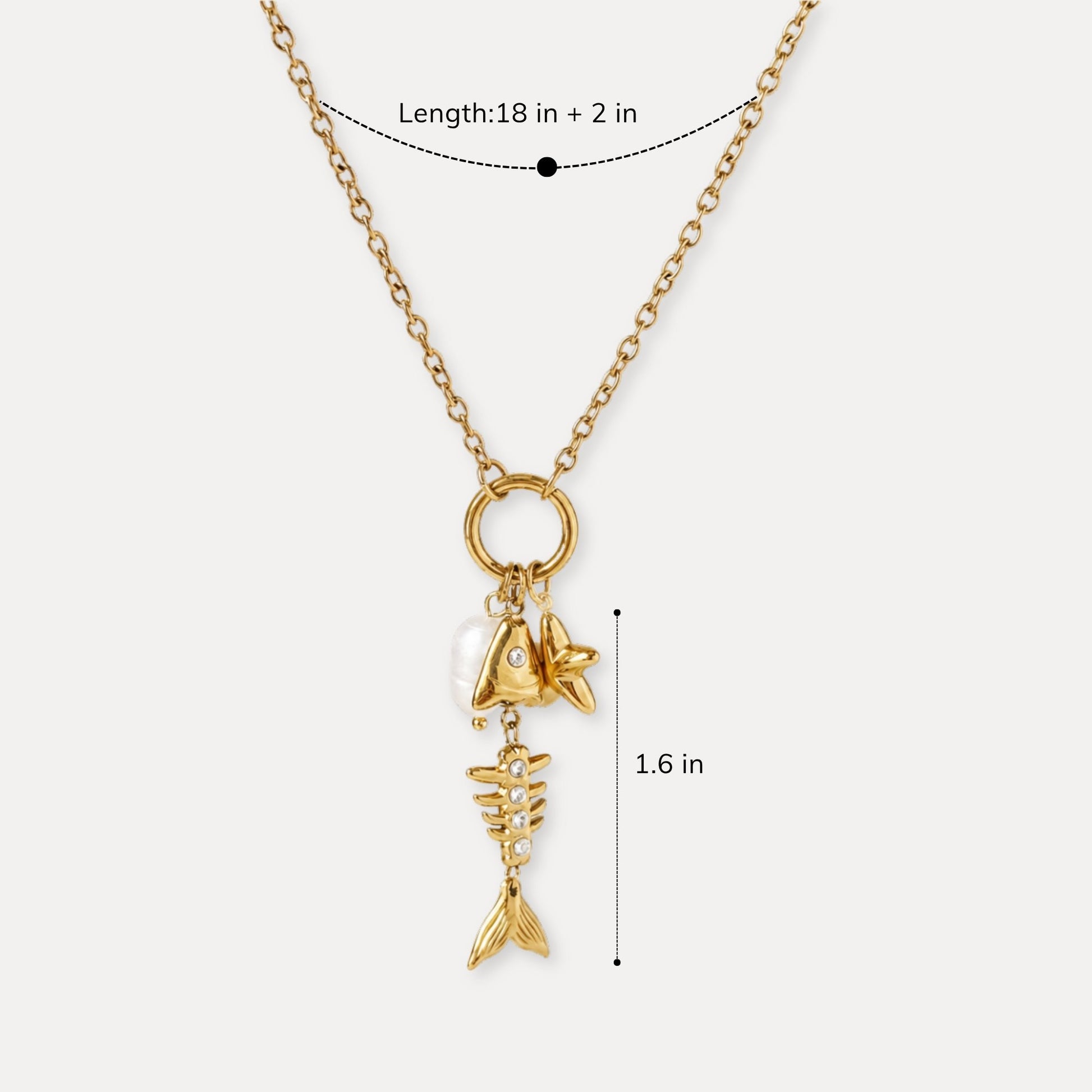 Gold charm necklace shown with 18 inch length and 2 inch extender.