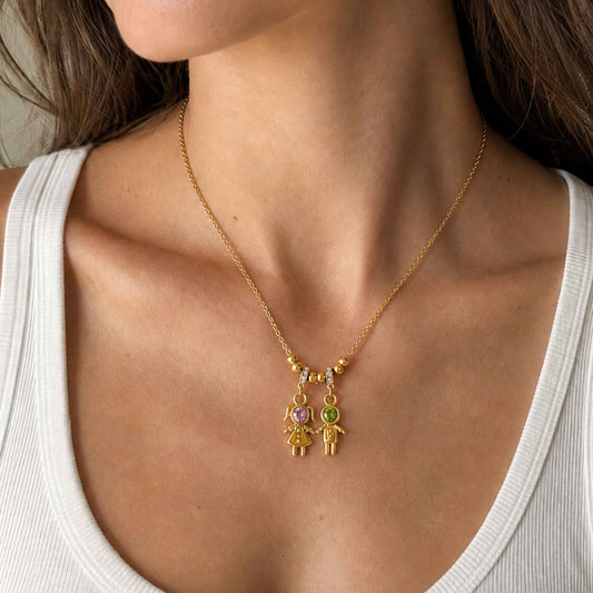 Side by Side Duo Charm Necklace worn alone at the neckline with two petite figure charms resting at the center