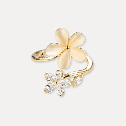 Adjustable gold flower ring with a soft cat’s eye flower and sparkling zircon flower detail.