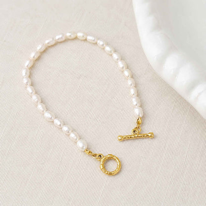 Close-up of freshwater pearls and 18k gold-plated stainless steel toggle clasp.