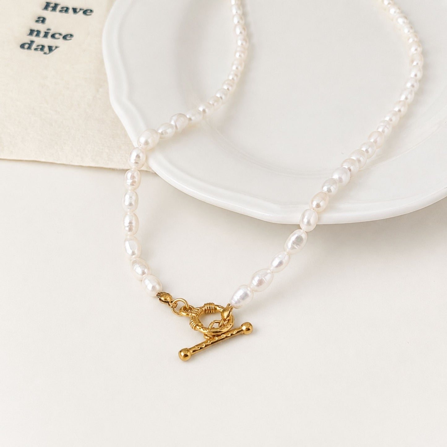 Close-up of freshwater pearls and 18k gold-plated stainless steel toggle clasp.