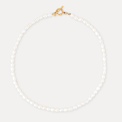 Freshwater pearl necklace with a gold toggle clasp and soft natural pearl texture.