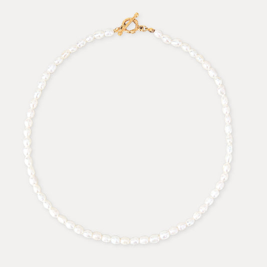 Freshwater pearl necklace with a gold toggle clasp and soft natural pearl texture.