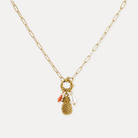 Gold pineapple charm necklace with freshwater pearl and natural stone accents.