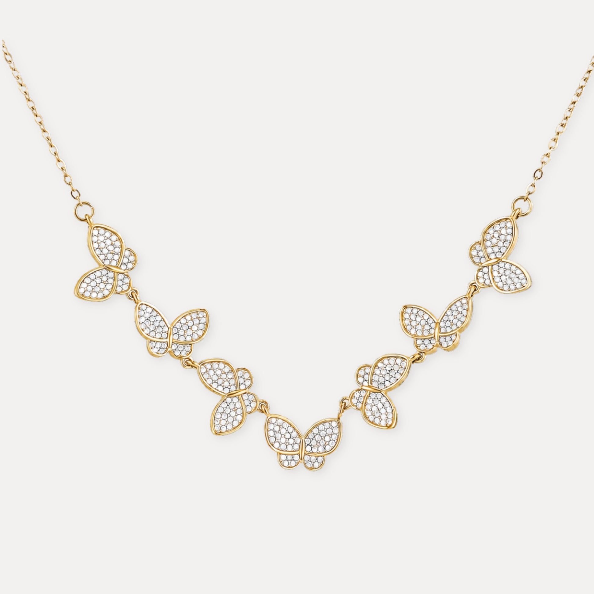Gold butterfly necklace with zircon details and 18k gold-plated stainless steel chain.