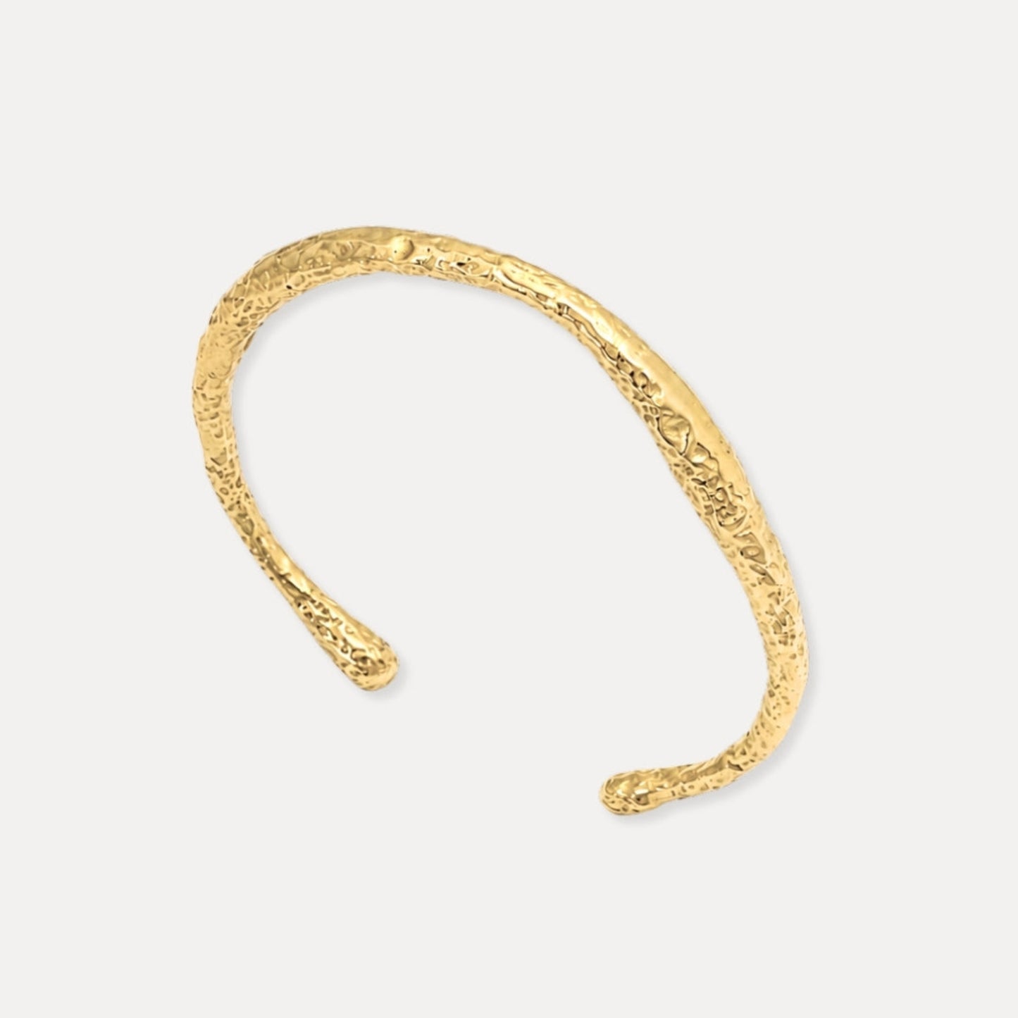 18k gold-plated stainless steel hammered cuff bracelet on a clean background