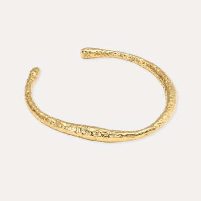 Open gold cuff bracelet with organic hammered texture