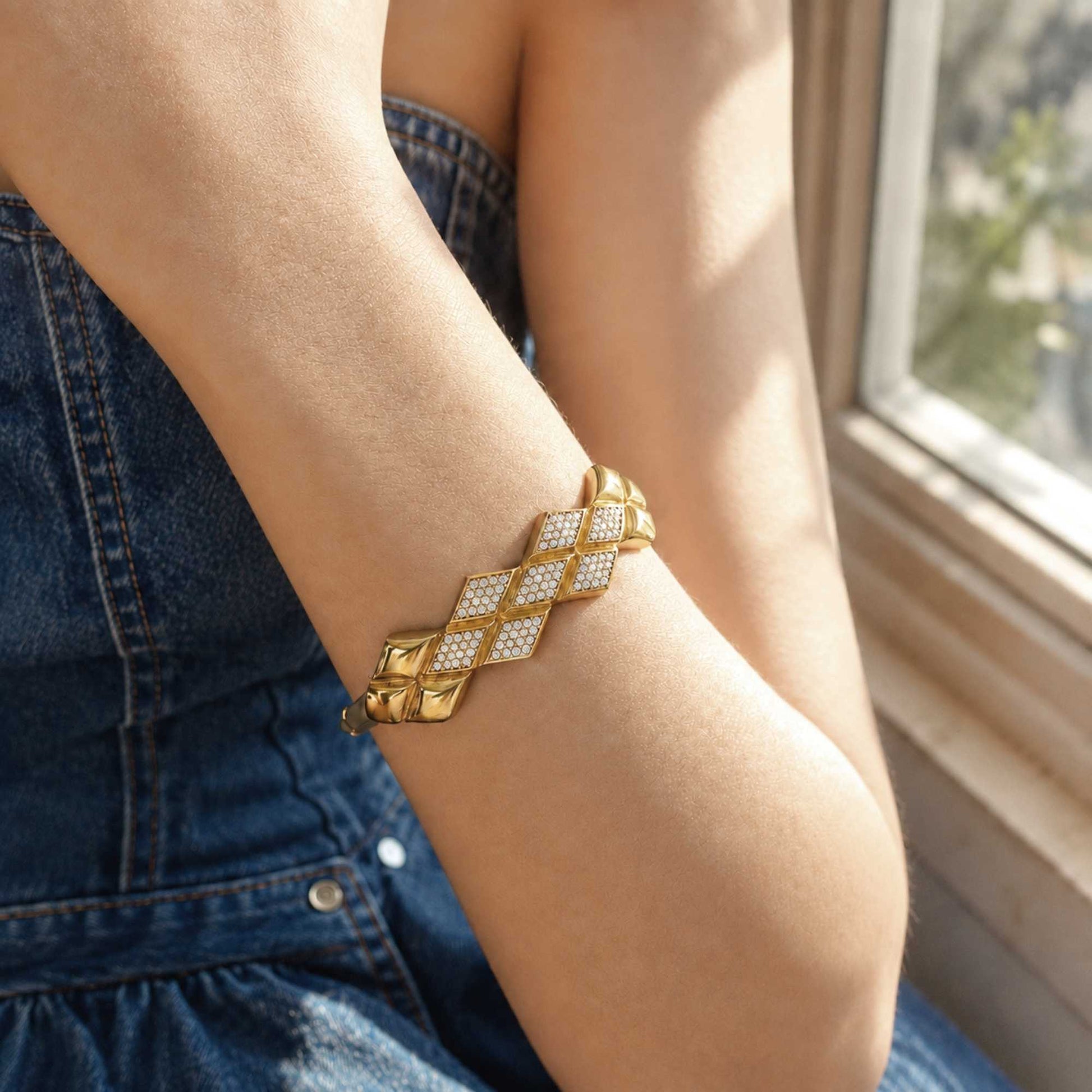 Woven CZ Bangle worn on the wrist with a denim outfit in warm natural window light